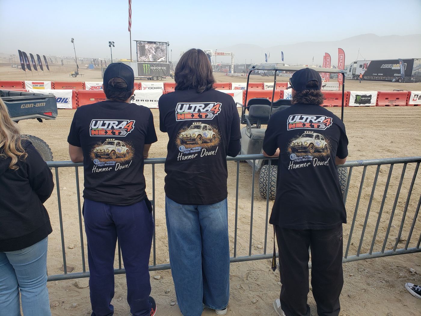 Students in Ultra4 shirts watching the race from the fence line at King of the Hammers