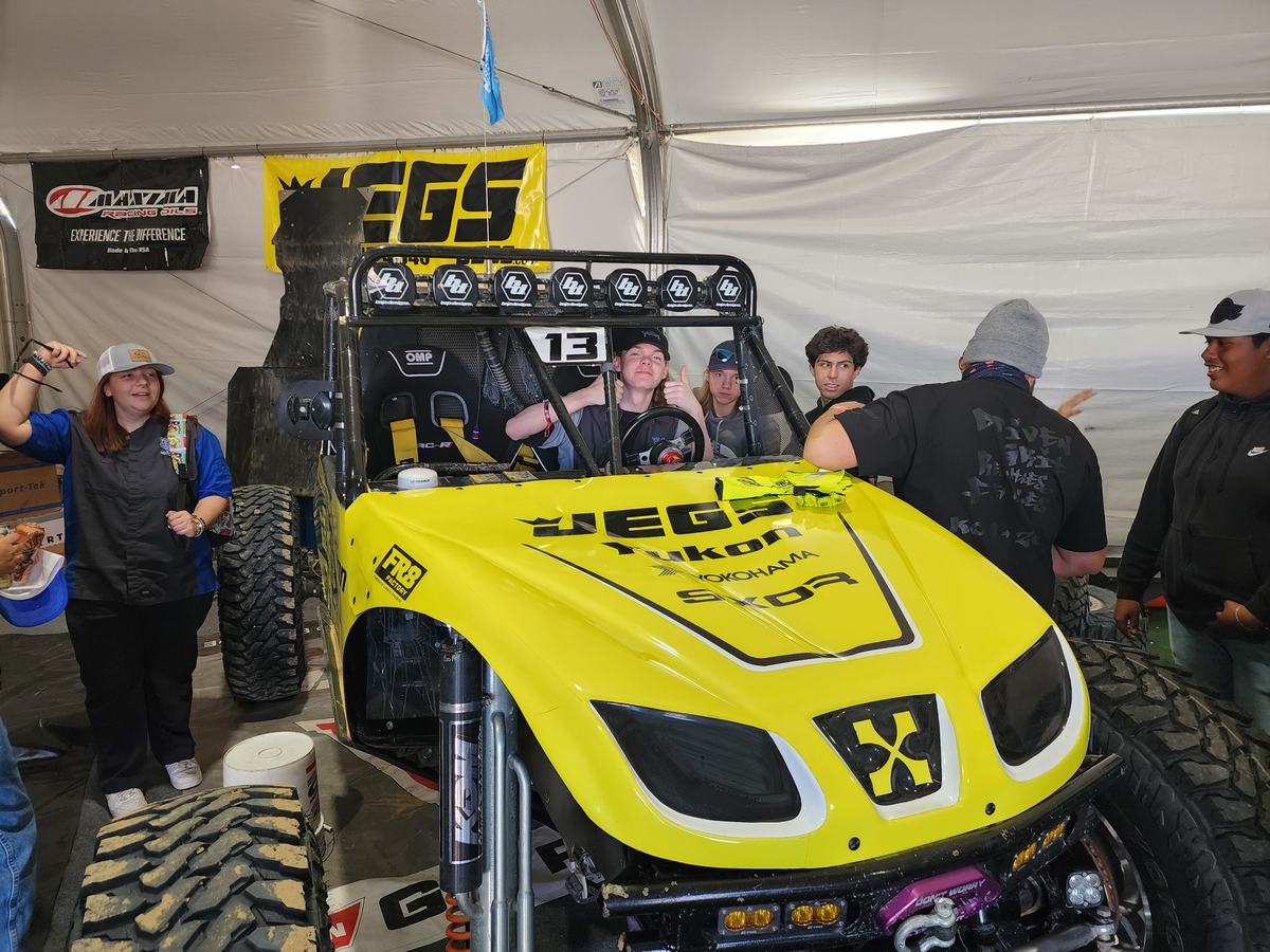 Students getting a close look at an Ultra4 race car
