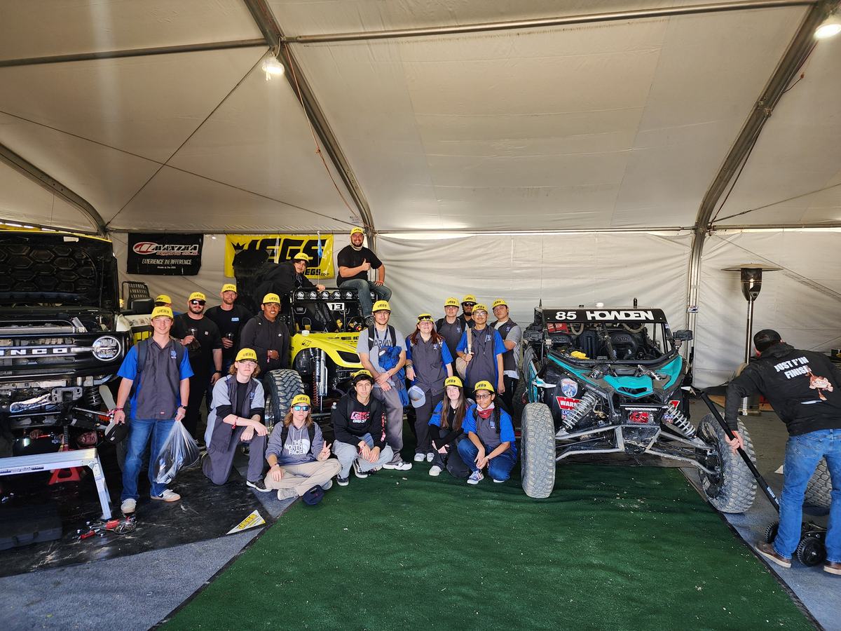 Student team photo in the paddock tent