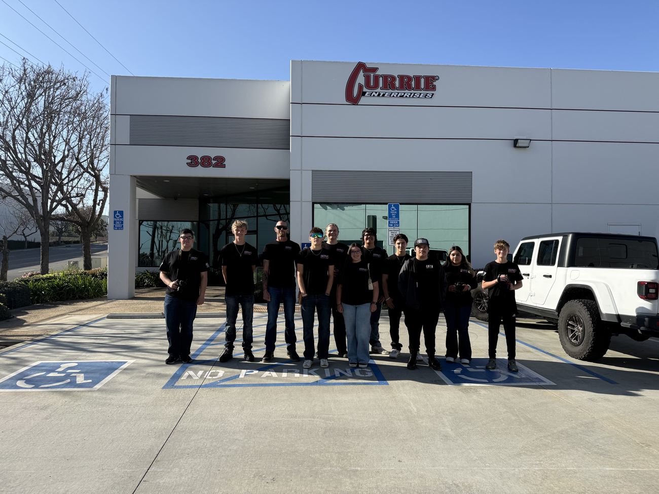 The group outside Currie Enterprises HQ