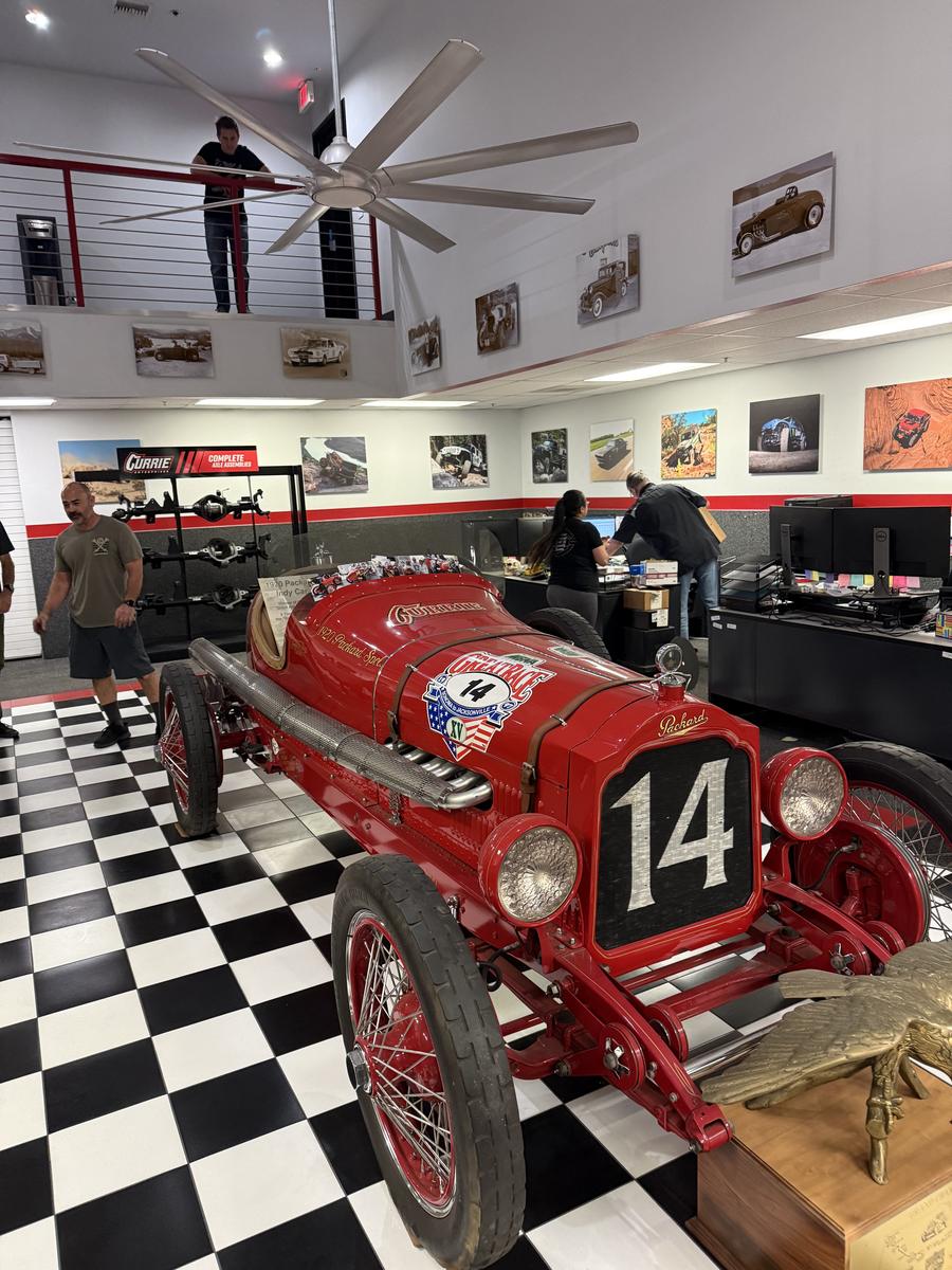 A heritage race car in the lobby of Currie Enterprises