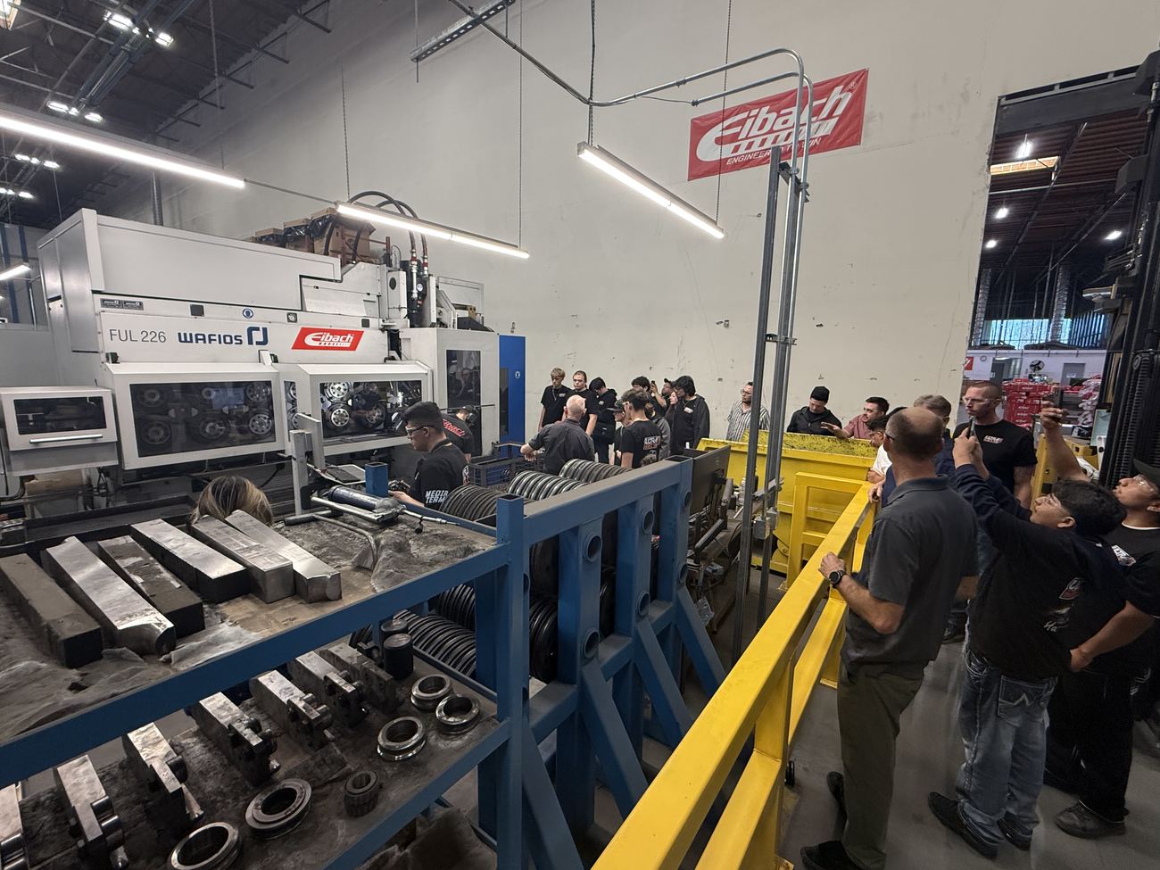Students on the Eibach spring production line