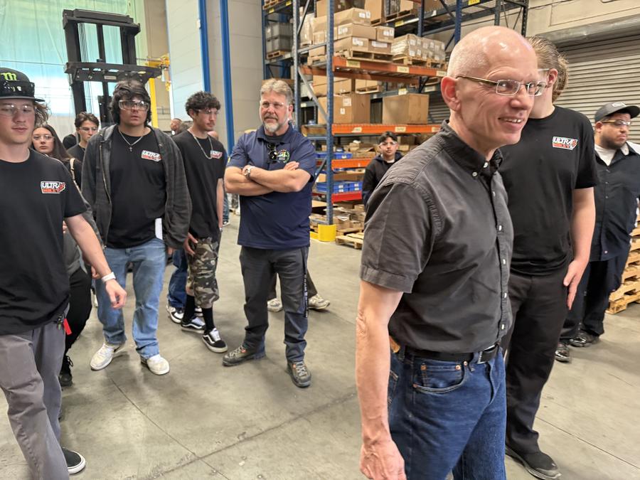 Christian Sebralla walks students through the warehouse