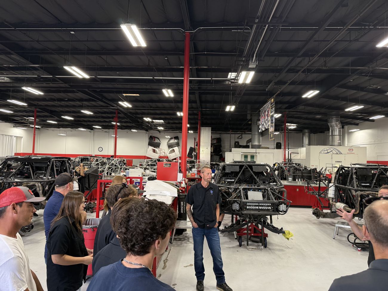 Shaun Kittrell walks students through the 1Nine Industries build floor
