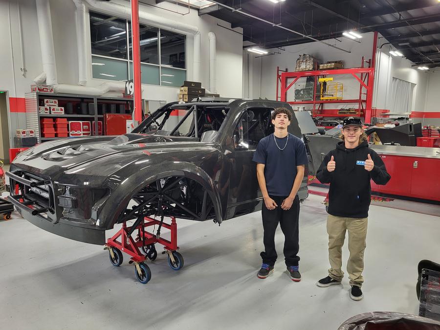 Students with a carbon-bodied race truck