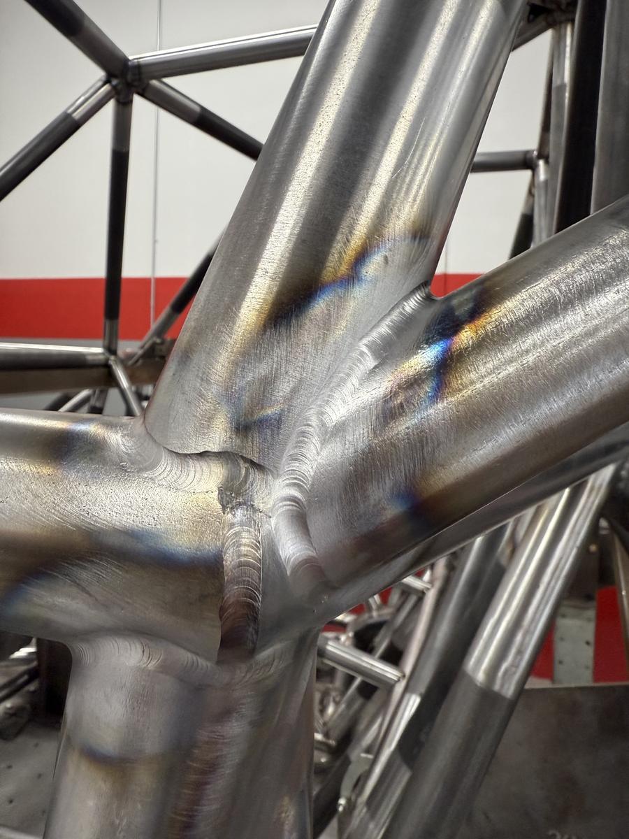 TIG welds on a chromoly cage — the standard students train toward