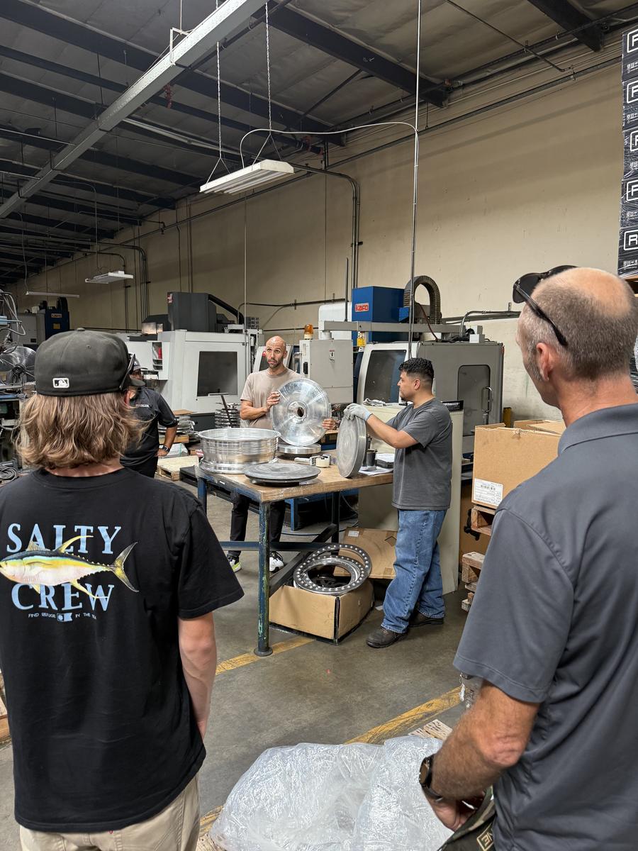 A machinist demonstrates wheel finishing